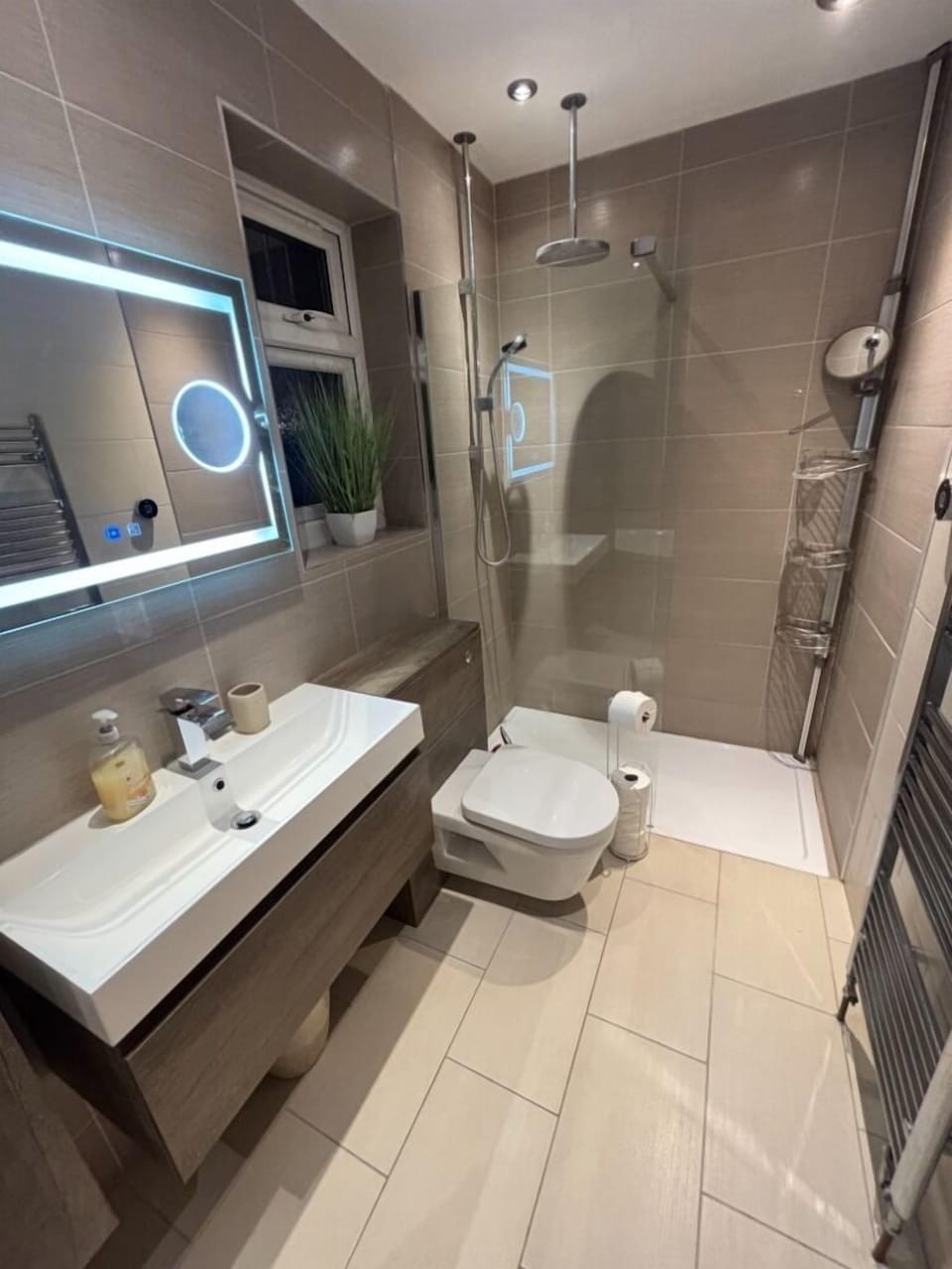 ensuite bathroom with rainfall walk-in shower