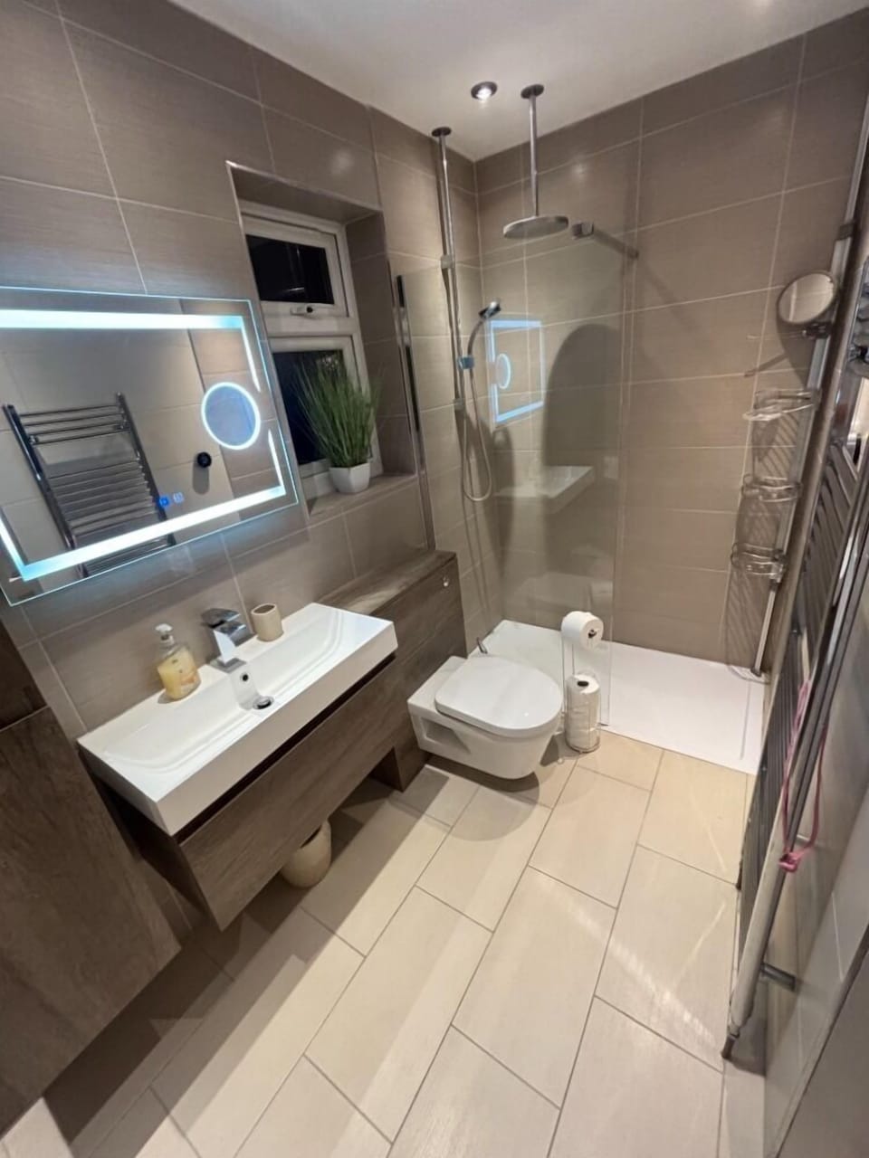 ensuite bathroom with rainfall walk-in shower