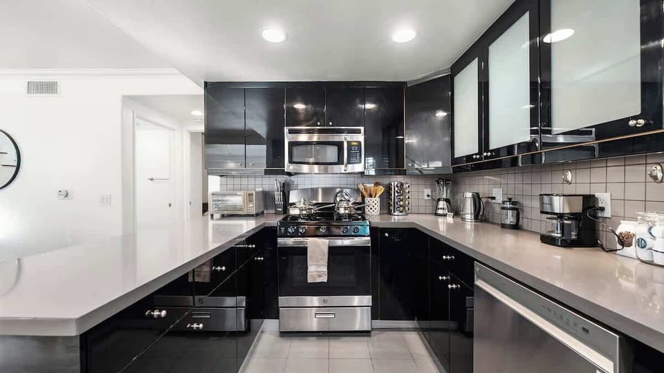 Fully equipped kitchen with modern appliances, perfect for preparing meals or quick snacks during your stay.