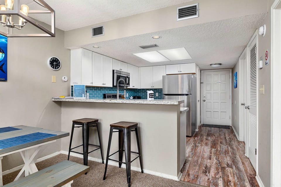 Kitchen island space designed for sharing meals, coffee, and conversation