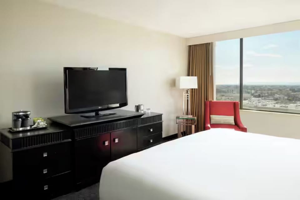Enjoy a sunlit room with sweeping views and modern comforts.