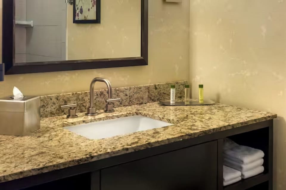 Refresh at the granite vanity with spa-style essentials.