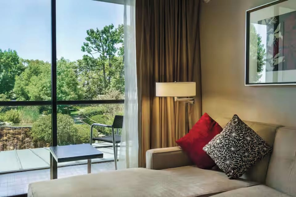 Sip morning coffee on the balcony overlooking leafy views.