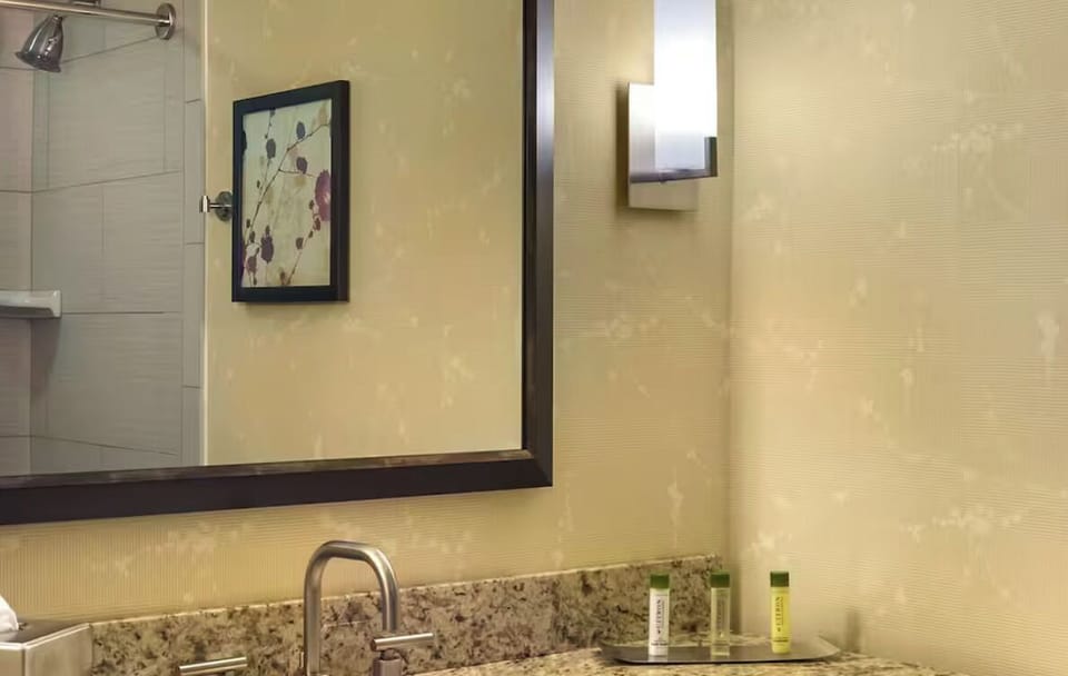 Refresh at the granite vanity with bright, flattering mirror light.