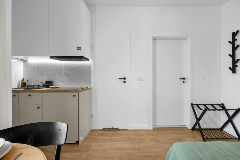 Bright Dining Area with Cozy Table & Fully Equipped Kitchenette | Book Now with RENTUJEMY.COM