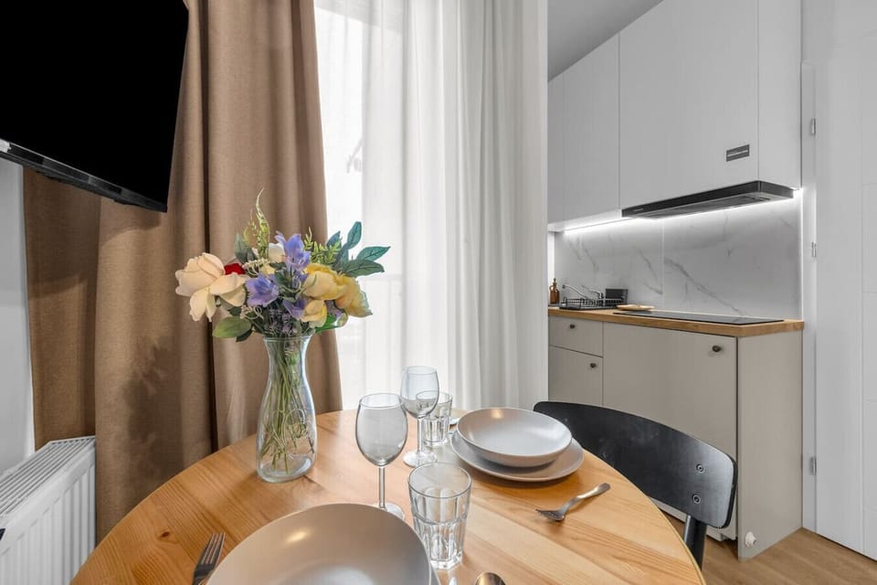 Bright Dining Area with Cozy Table & Fully Equipped Kitchenette | Book Now with RENTUJEMY.COM