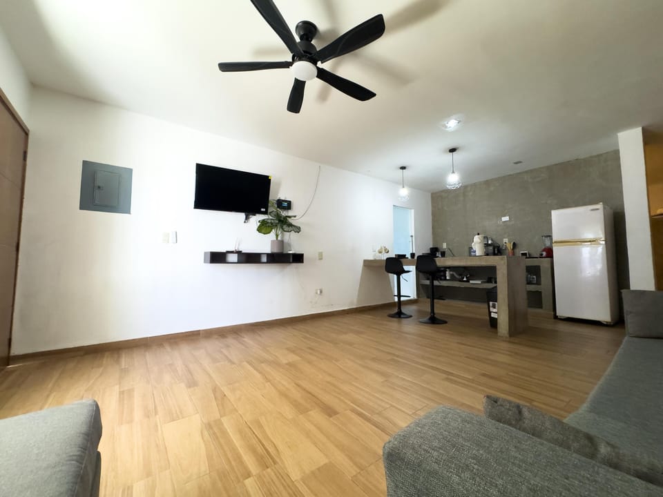 Spacious open living area with modern kitchen and cozy seating