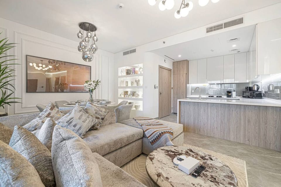 Elegant open-plan living with luxe décor and a modern kitchen.