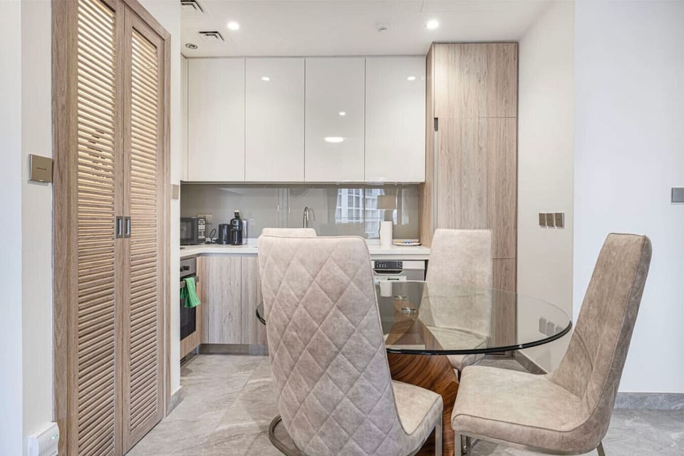 Warm wood finishes and clean, contemporary design create a welcoming space for cooking and gathering