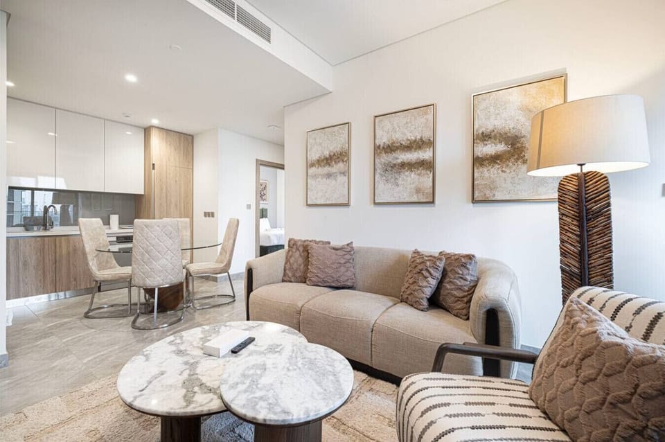 Stylish comfort meets convenience in this airy living space with soft neutrals and contemporary décor.