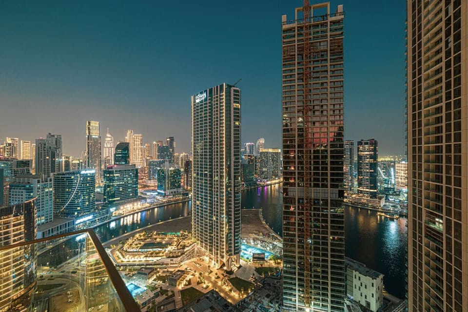 “Immerse yourself in breathtaking skyline and waterfront views—your private balcony overlooking the glittering heart of the city.