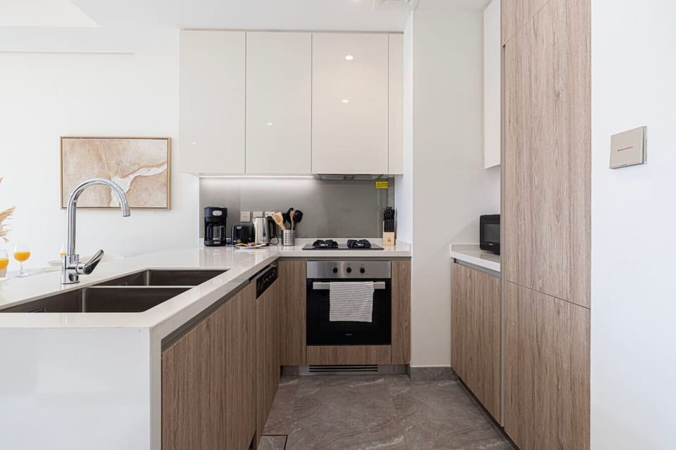 ✨ “Sleek, modern kitchen with all essentials for a comfortable stay.”