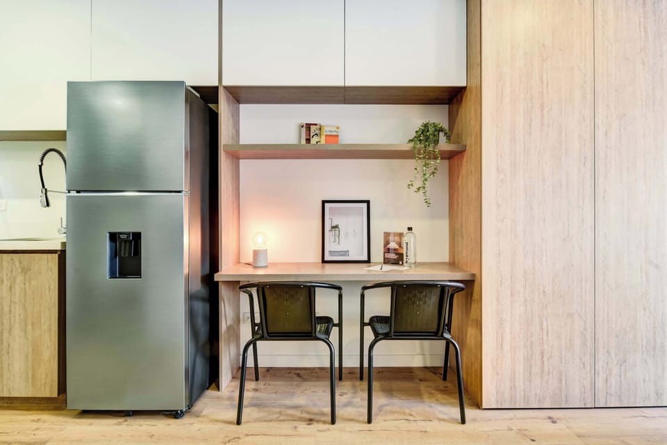 Open kitchen and desk, perfect for meals or remote work.