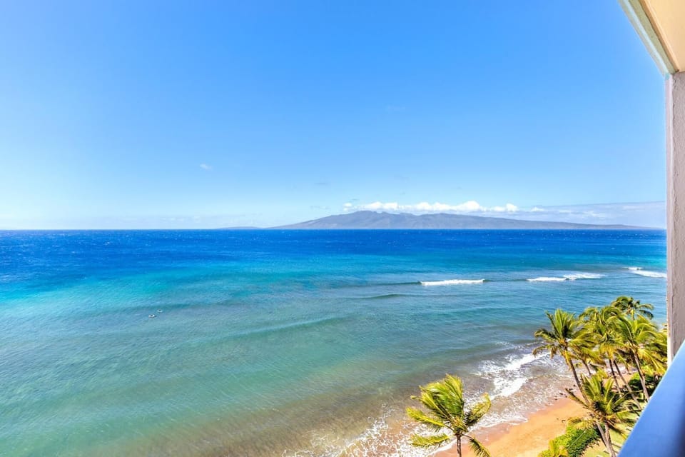 Float above the shoreline where emerald tides meet golden sand—your daily view is a watercolor of the sea MAH-1211