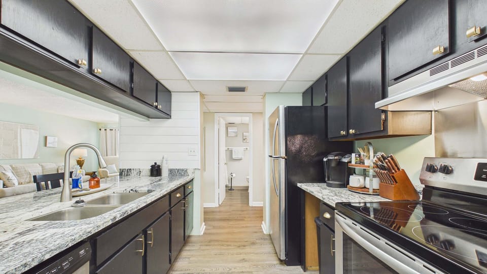 Fully applianced kitchen with all the cooking essentials and plenty of counter space for meal prep