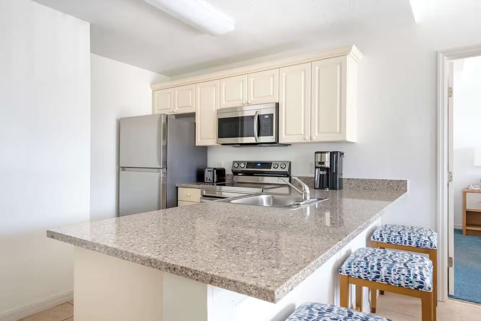 Cook effortlessly with full appliances and generous breakfast bar.