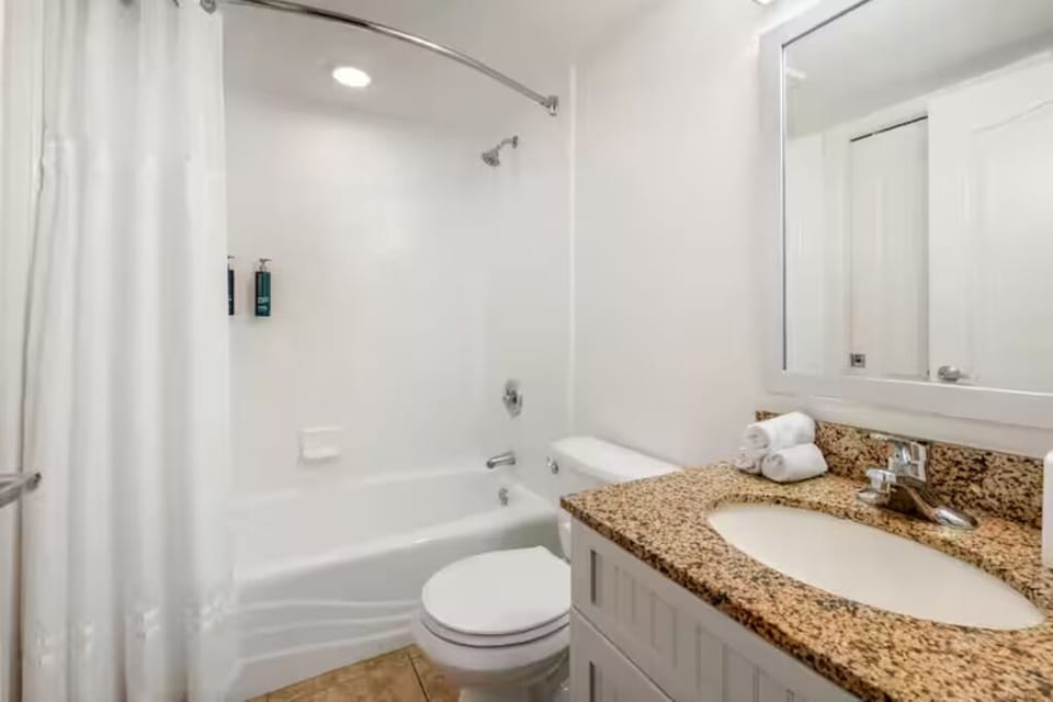 Refresh in a spotless bath with tub-shower combo.