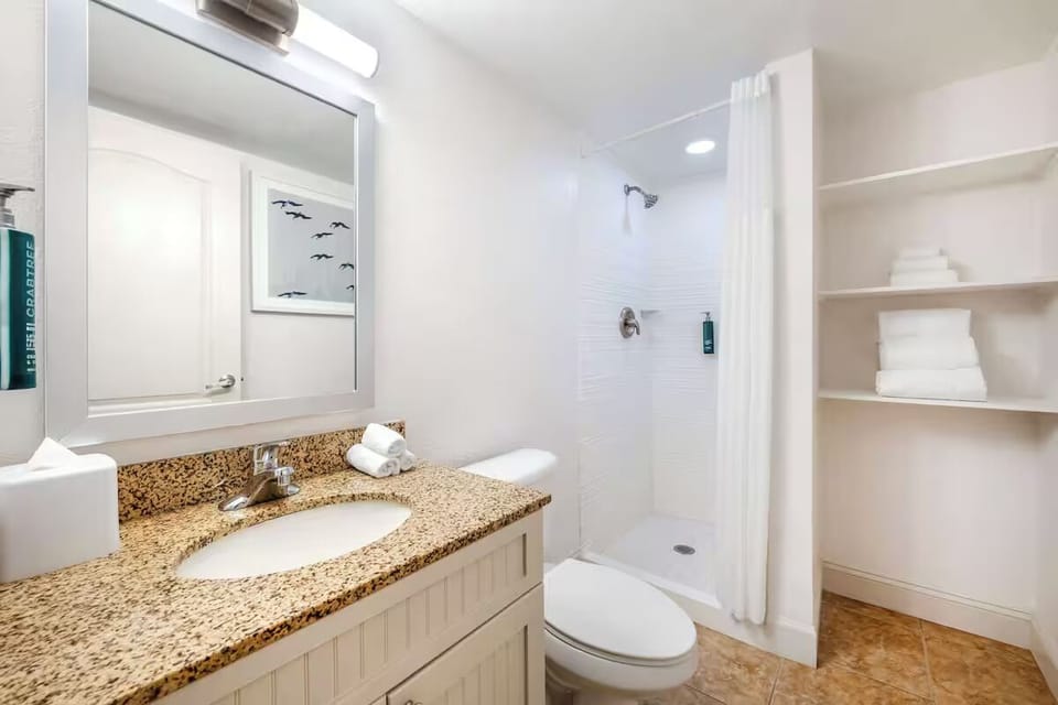 Rinse off in the walk-in shower with fresh towels nearby.