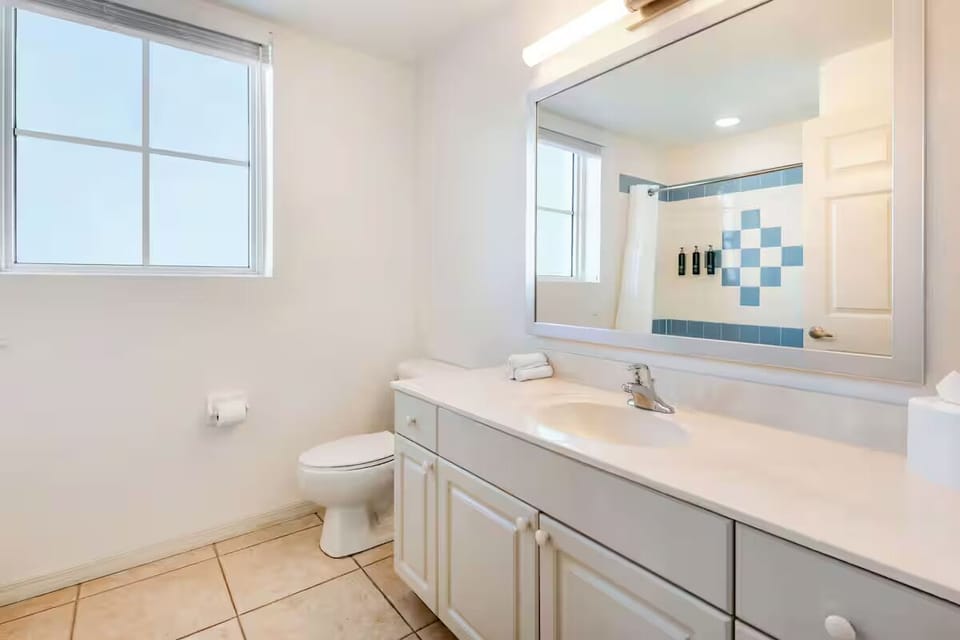Refresh easily in a bright bath with roomy vanity.