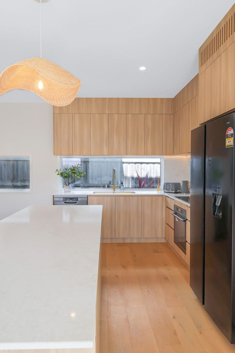 Contemporary kitchen featuring island bench and full amenities.