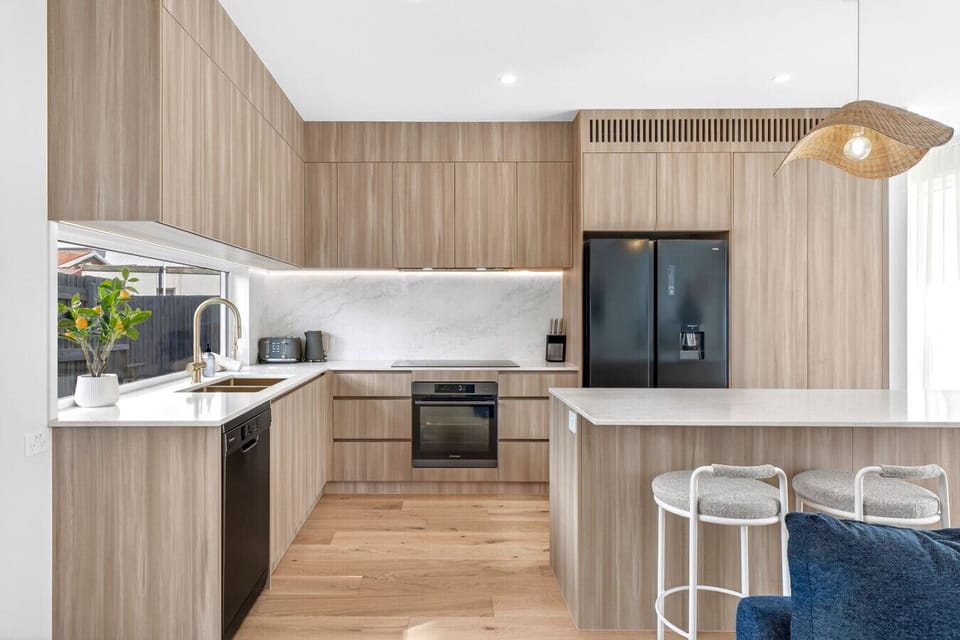 Kitchen with premium appliances, ample storage, and a clean, modern design—perfect for home cooking.