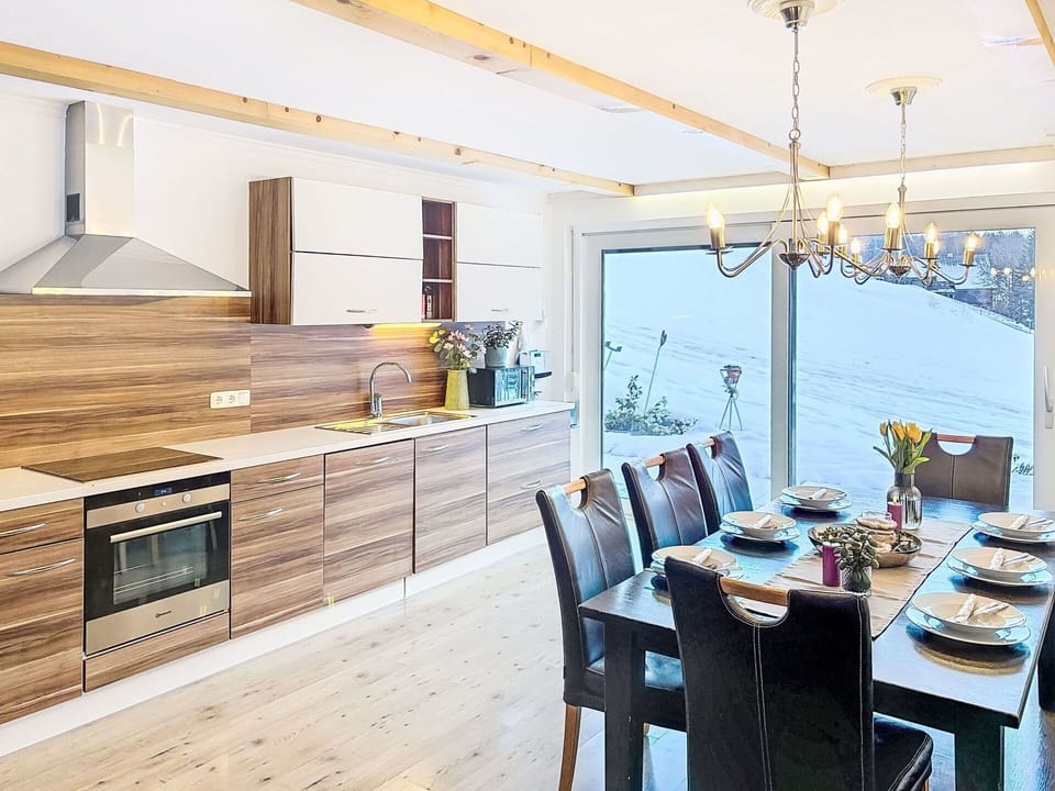 Furniture, Interior Design, Wood, Flooring, Wood Flooring, Floor, Ceiling, Kitchen, Countertop, Lighting