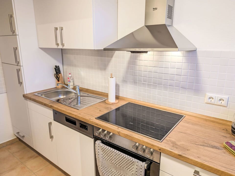 Kitchen, Countertop, Kitchen Appliance, Major Appliance, Cabinetry, Flooring, Wood, Interior Design, Home Appliance, Kitchen Stove