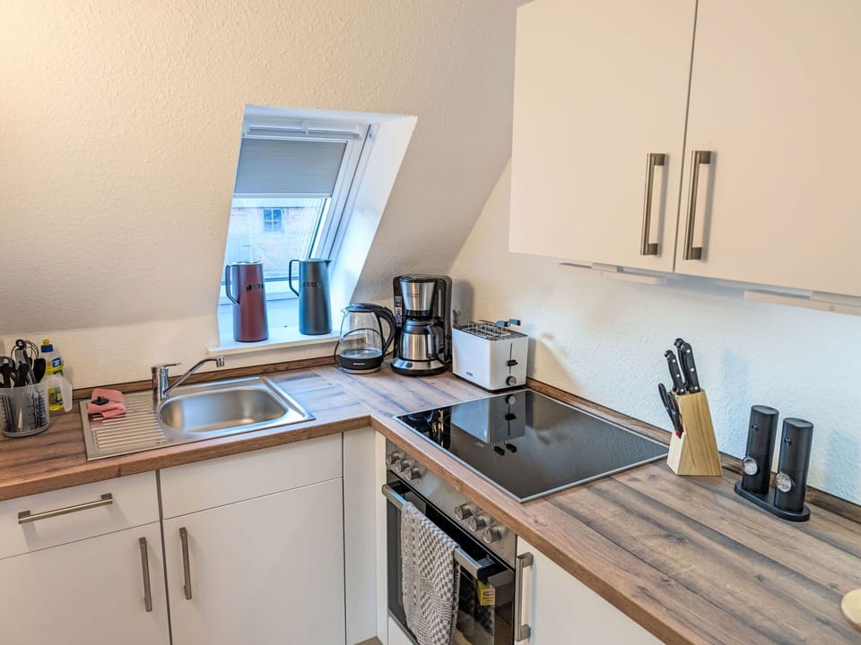 Kitchen, Countertop, Kitchen Appliance, Major Appliance, Wood, Flooring, Interior Design, Furniture, Sink, Plumbing Fixture