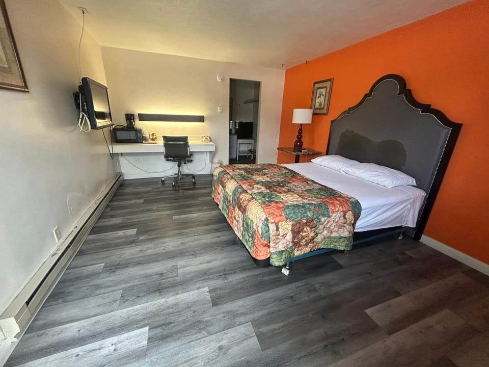 Relax in a bright king room with cozy seating area.