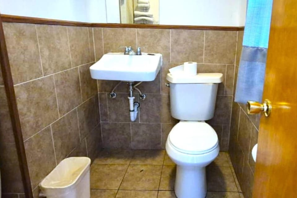 Freshen up quickly with a straightforward, functional private bathroom.