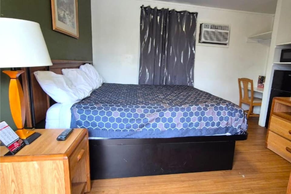Relax in bed with TV time and in-room conveniences nearby.