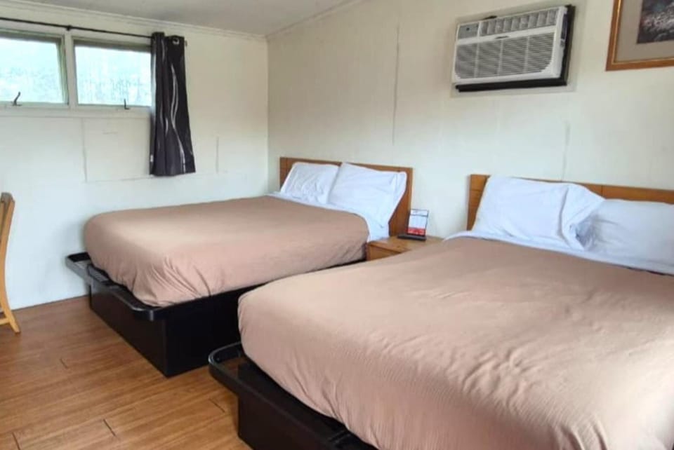 Stretch out and enjoy extra space around both beds.