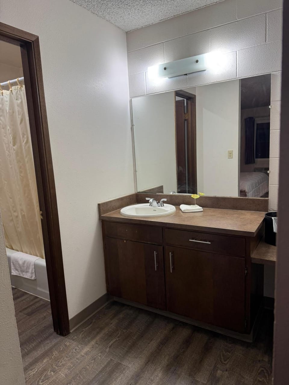Get ready smoothly with a spacious vanity and bright mirror.