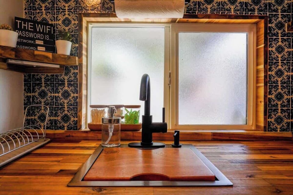 Compact kitchenette with essential appliances and everything needed for quick meals or snacks.