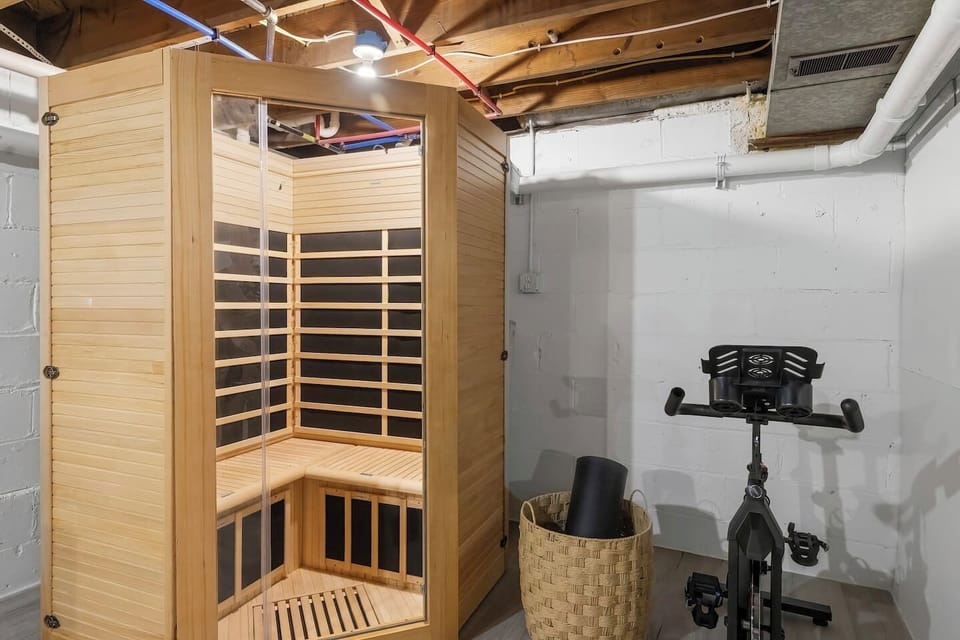 Sauna and stationary bike in the game room. 