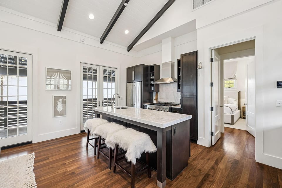 Bright, airy kitchen with vaulted ceilings and cozy seating