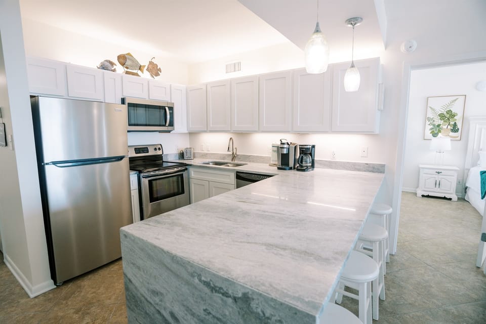 Large countertop / bar area, with a view! Open kitchen layout so you can cook, snack, and still be part of the conversation.