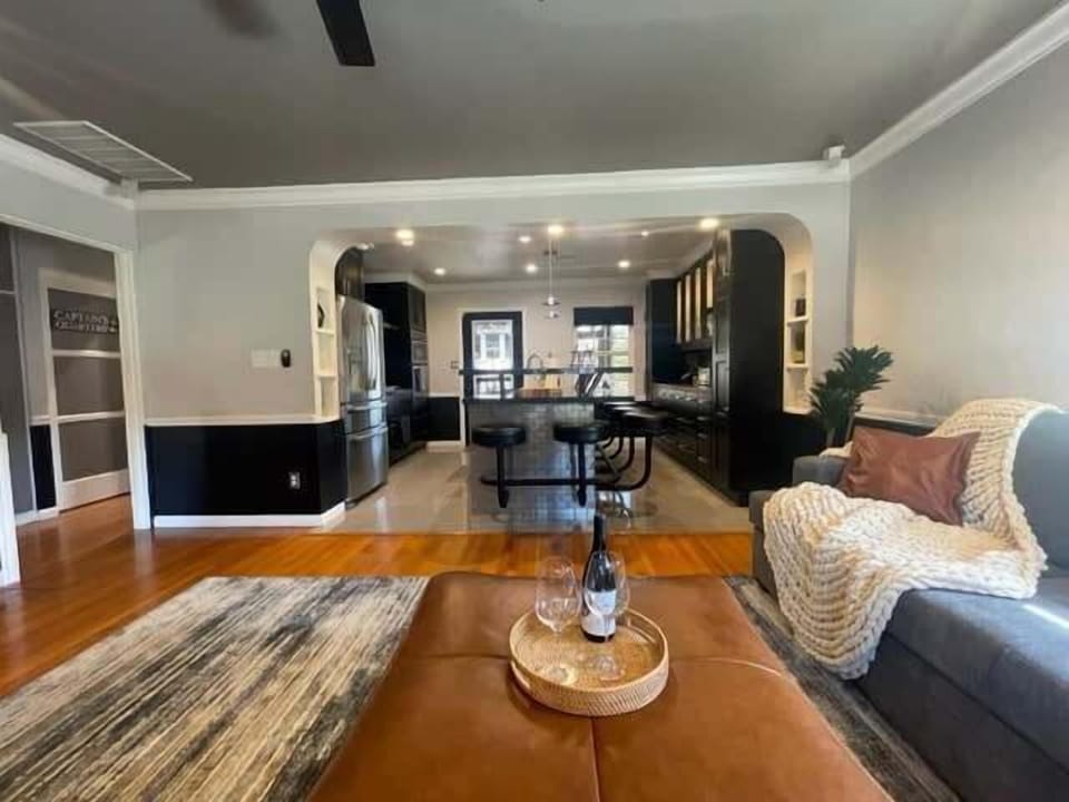 View of the cozy living room and a modern designed kitchen 