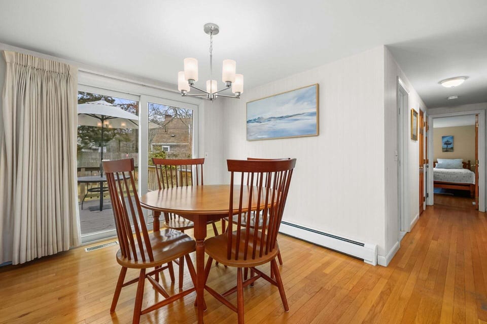 Dining area with views of the backyard and deck