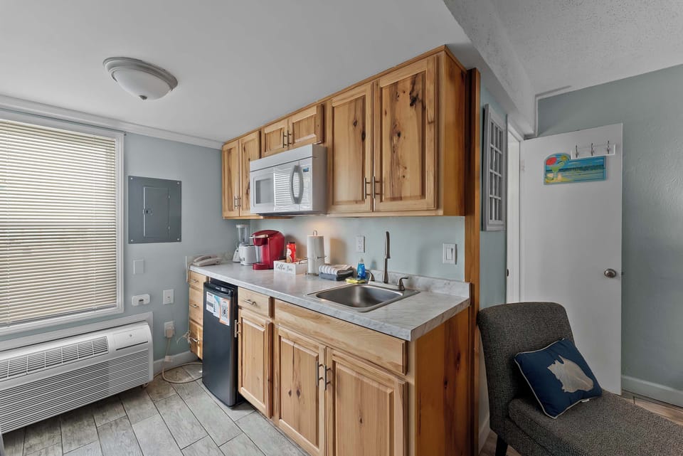 Compact kitchenette with essentials for quick breakfasts, coffee, and simple meals