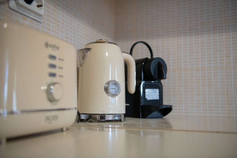 Coffee station with kettle, toaster, and espresso machine