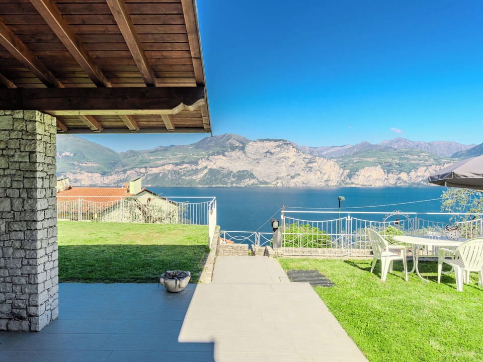 Coastal And Oceanic Landforms, Mountain Range, Coast, Lake, Outdoor Furniture, Sea, Resort, Shade, Swimming Pool, Chair