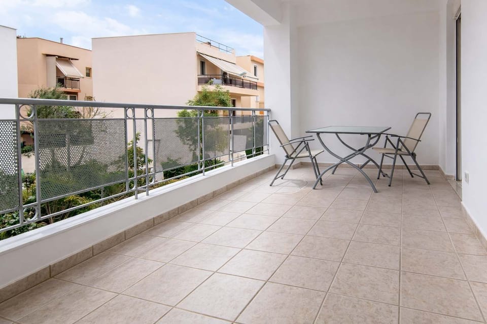Spacious private balcony with tiled flooring and outdoor seating, perfect for enjoying fresh air and peaceful surroundings. The open layout provides plenty of room to relax, unwind, and take in the view