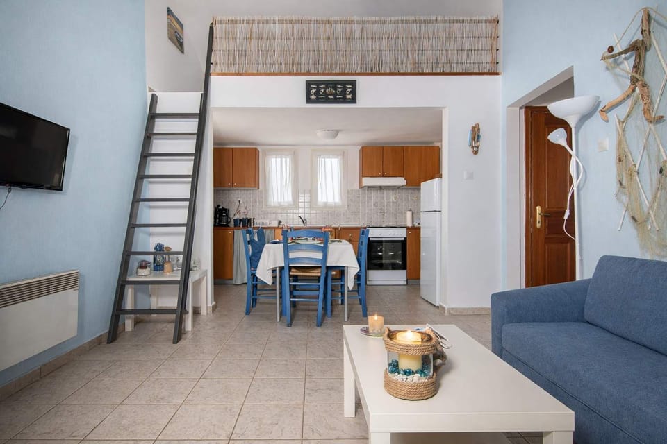 Open-plan common space combining living, dining, and kitchen areas, designed for comfort and functionality in a bright, welcoming setting