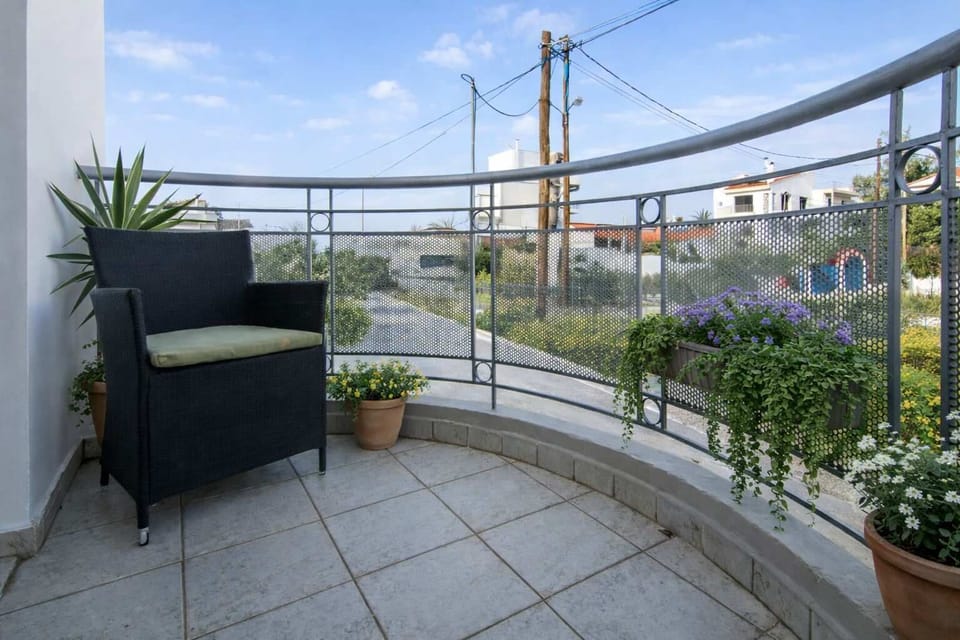 Enjoy your morning coffee or evening drink on this cozy balcony overlooking the neighborhood. A peaceful outdoor space just minutes from the beach and 7 km from Volos town center