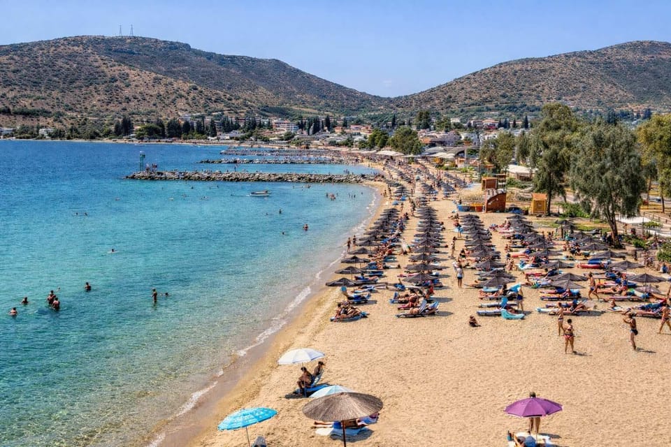 Sandy Alykes Beach with calm, shallow waters ideal for swimming and relaxing. Easily accessible within a short walk, making it perfect for daily seaside escapes