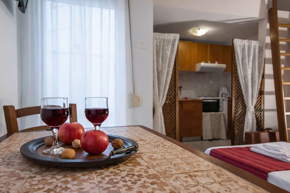 Charming dining space with a wooden table, perfect for enjoying meals or drinks in a relaxed and cozy environment