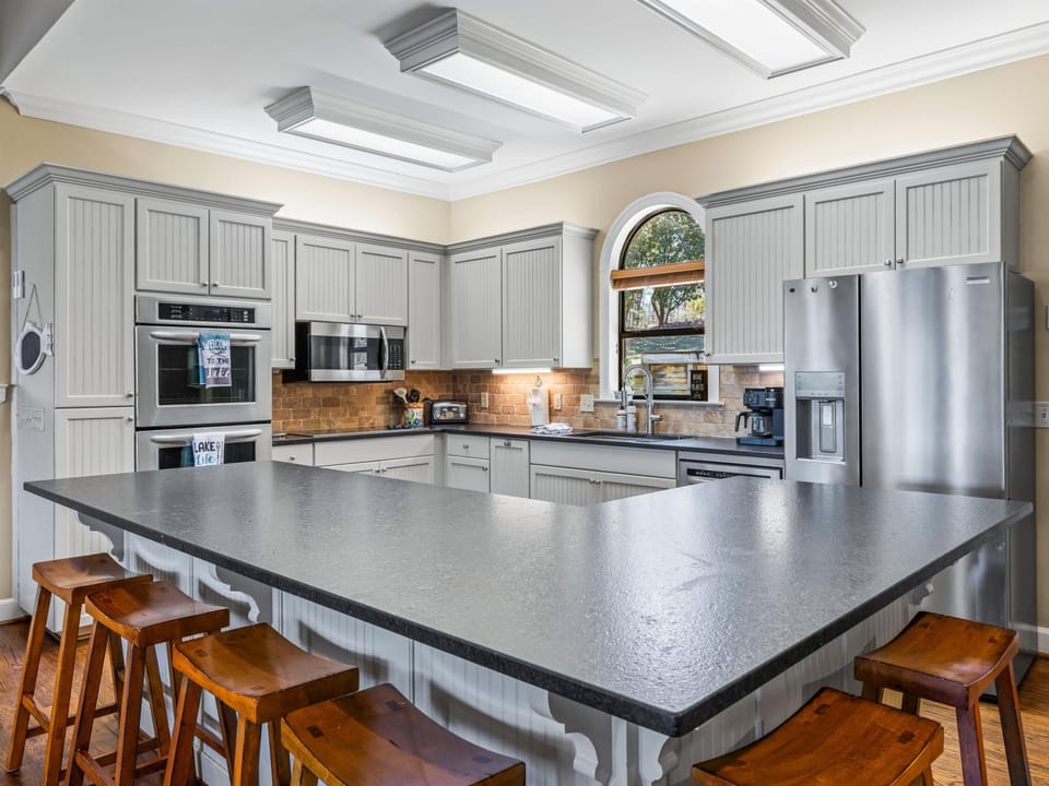 Large kitchen with a lot of counter space and double ovens