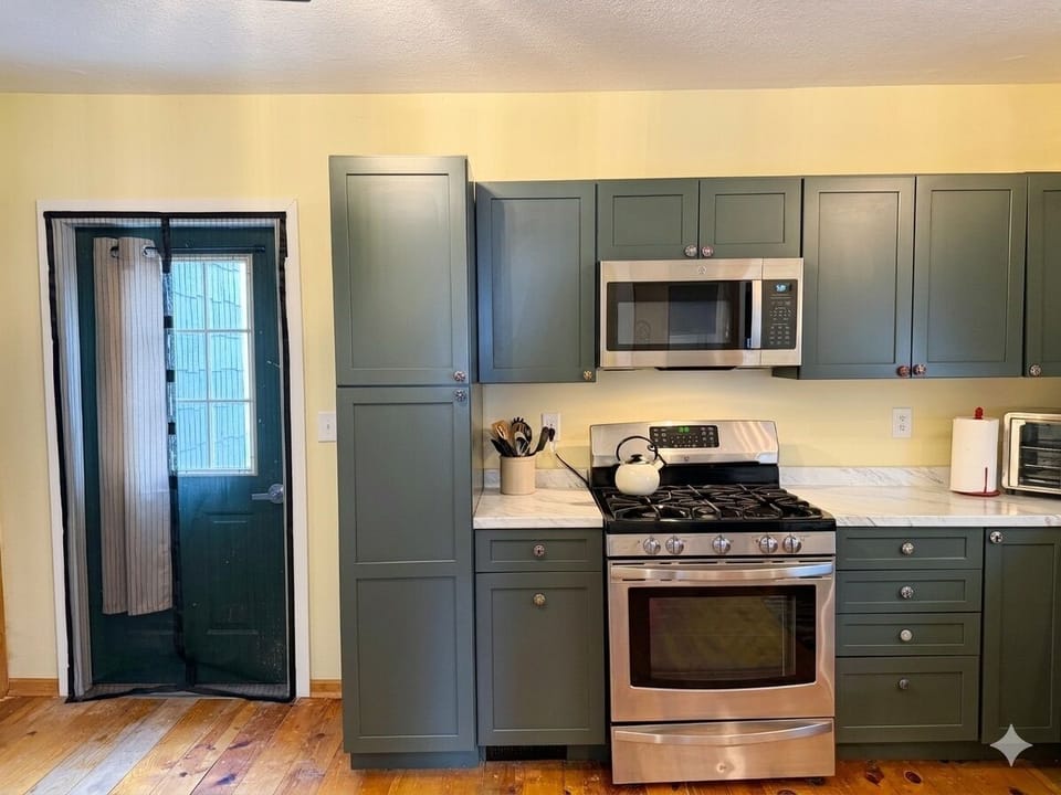 The kitchen leads out to a small patio.