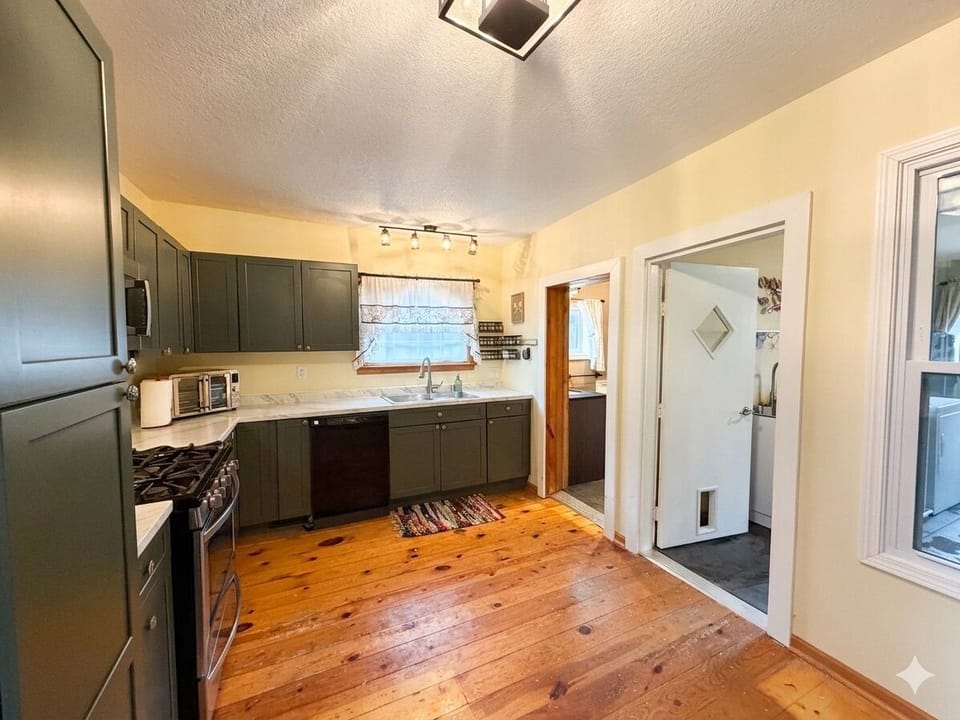 The kitchen leads to both the bathroom, laundry and dining room.